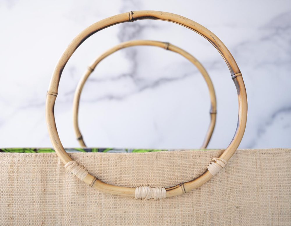 Top View of the Bamboo Handles of the Shebobo Bebe Straw Bag with Bamboo Handles
