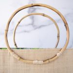 Top View of the Bamboo Handles of the Shebobo Bebe Straw Bag with Bamboo Handles