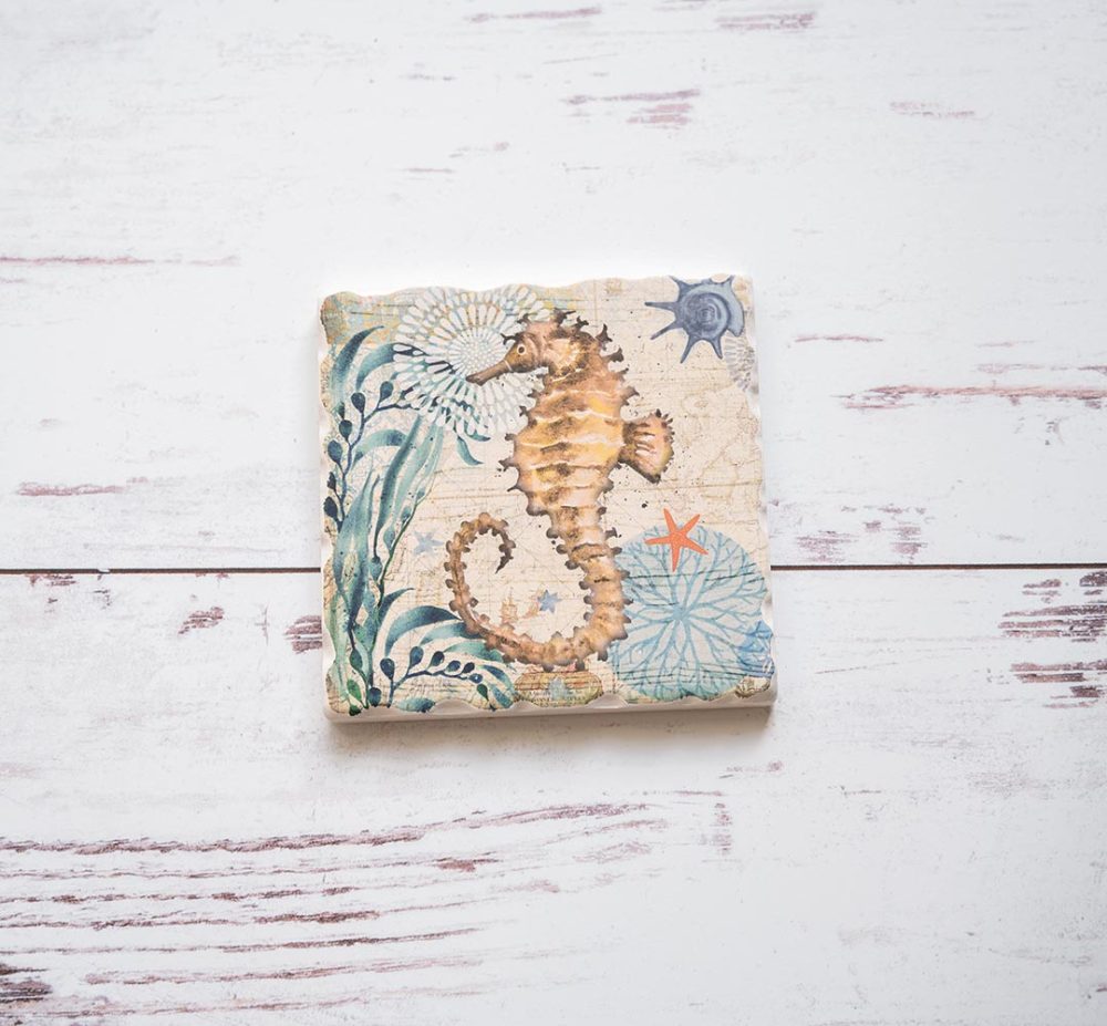 CounterArt & Highland Home Nautical Ocean Life Seahorse coaster on a white rustic wood background