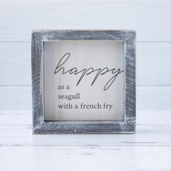 Front View of the Happy as a Seagull Wooden Accent Sign by Gia Roma on a Rustic White Wood Background