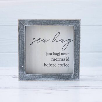 Front View of the Sea Hag Wooden Accent Sign by Gia Roma on a Rustic White Wood Background