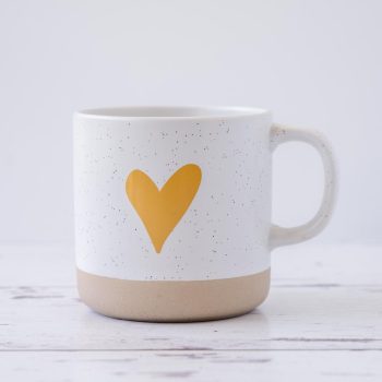 Clay Heart Coffee Mug by Doe A Deer on rustic wood and with a white background