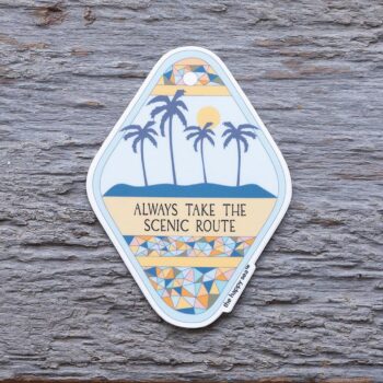 Always Take the Scenic Route Die-Cut Vinyl Sticker by the Happy Sea on a Weathered Rustic Piece of Wood