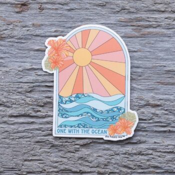 One with the Ocean Die-Cut Vinyl Sticker by the Happy Sea on a Weathered Rustic Piece of Wood