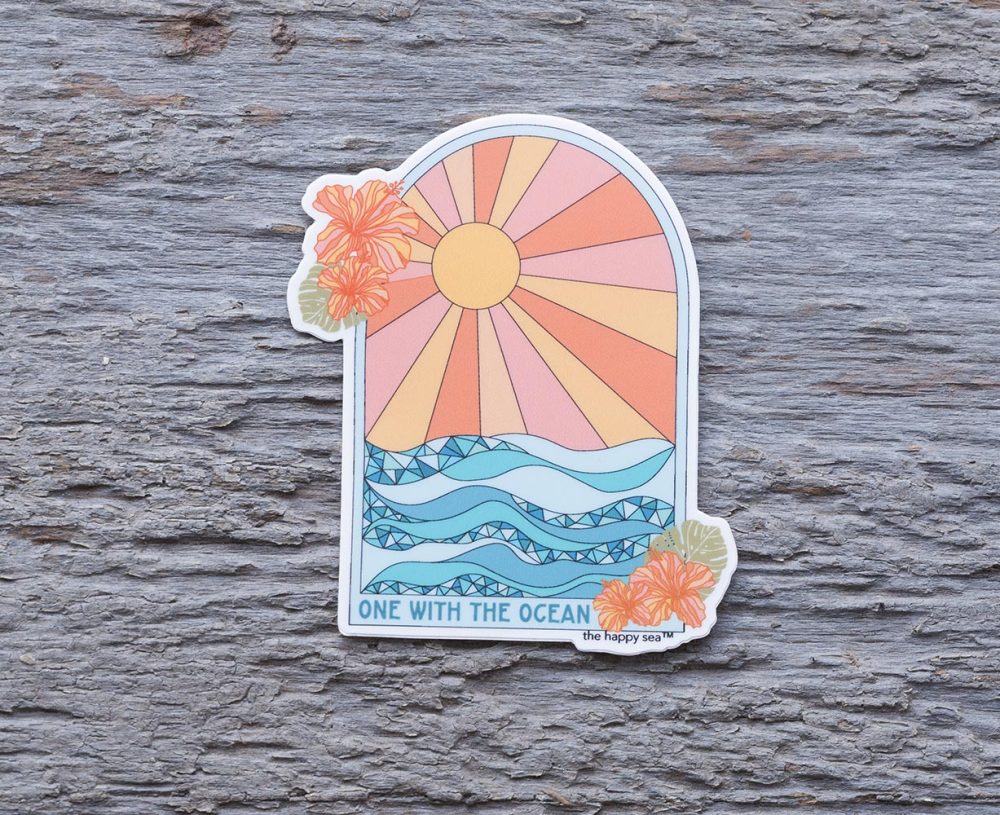 One with the Ocean Die-Cut Vinyl Sticker by the Happy Sea on a Weathered Rustic Piece of Wood