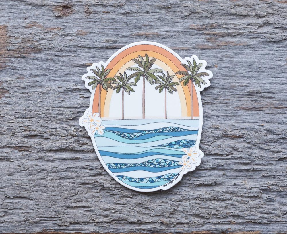 Retro Rainbow Ocean Die-Cut Vinyl Sticker by the Happy Sea on a Weathered Rustic Piece of Wood