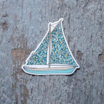 3" Die-Cut Sailboat Sticker by the Happy Sea Against a Rustic Wood Background