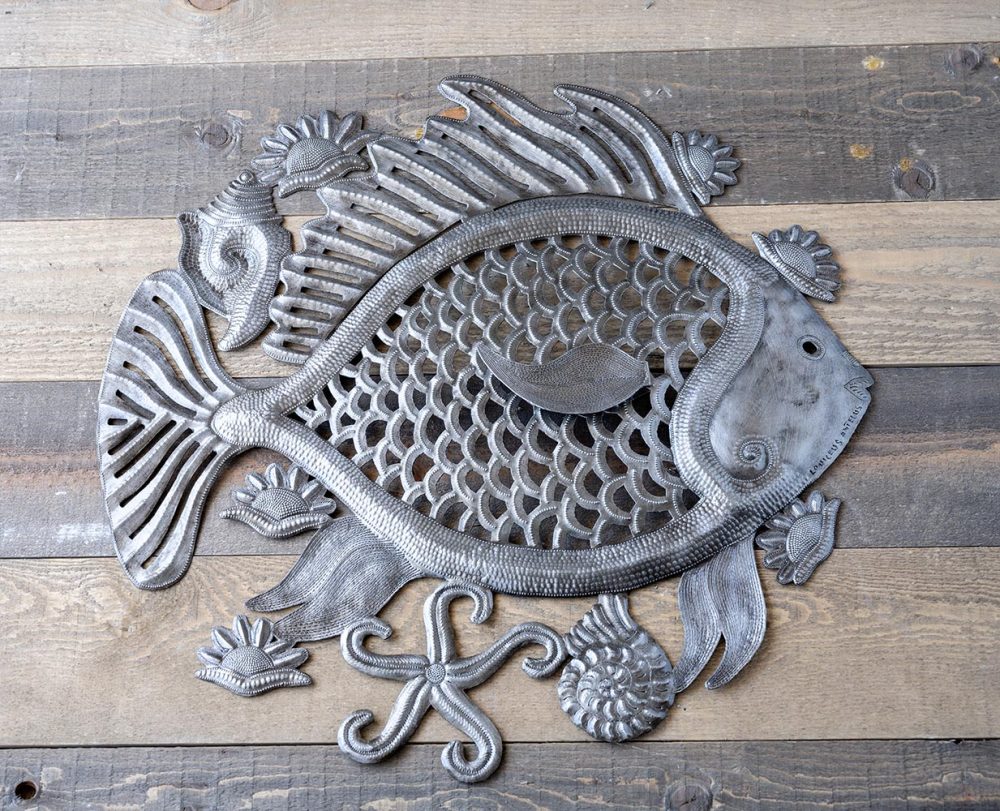 Top View of the Big Fish Wall Decor Piece by Papillon Marketplace on a Wood Background