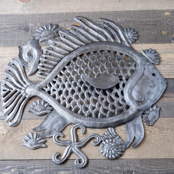 Top View of the Big Fish Wall Decor Piece by Papillon Marketplace on a Wood Background