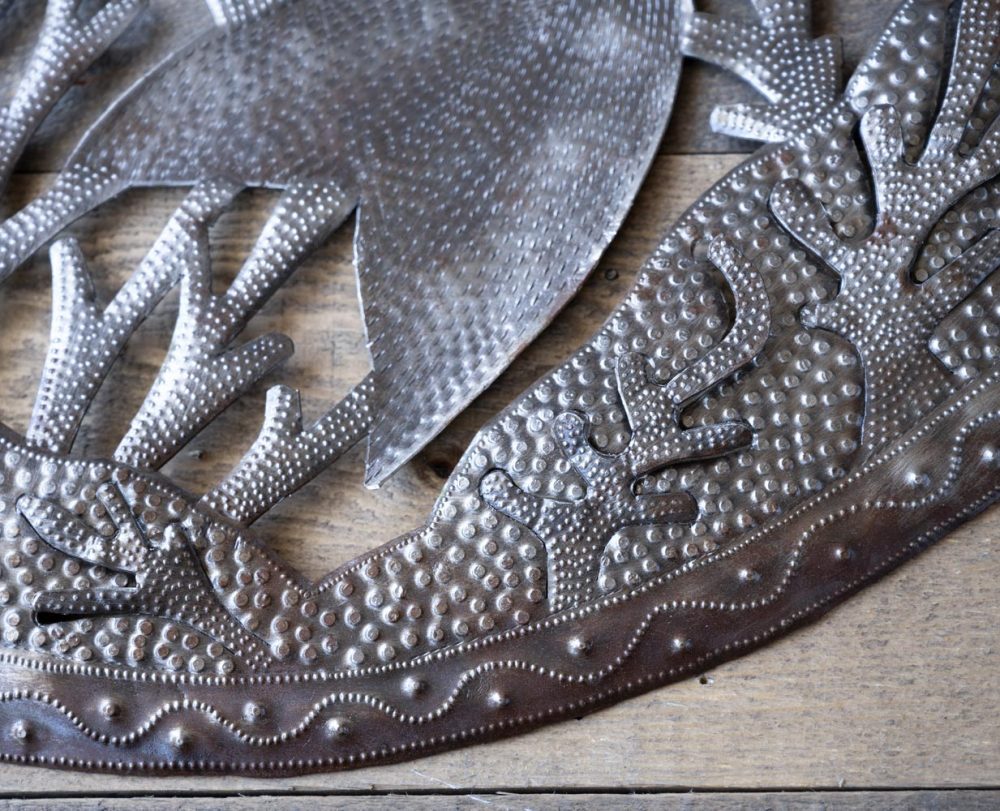 Closeup Bottom View of the Skeleton Fish by Papillon Marketplace on a Wood Background