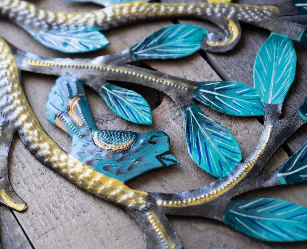 Closeup Detailed View of the colorful Mighty Tree Wall Piece by Papillon Marketplace on a Wood Background