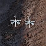 Anne Vaughn Designs Patina Dragonfly Earrings Agins a Rustic Piece of Wood