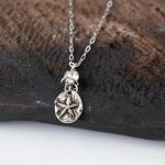 Front View of the Starfish Necklace with Swarovski Crystals by VB&CO Designs on Dark Wood