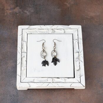 Top View of the VB&CO Designs Rustic Moonstone Celestial Leaf Earrings Moonstone and Leaves on a White Vintage Piece of Wood and Rustic Background