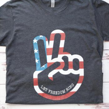 Flat Lay of the Women's Let Freedom Ring Graphic Tee in Mint by Costa Threads on a White Rustic Background