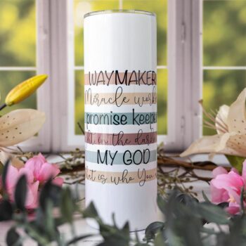 Front View of the Waymaker Stainless Tumbler in Front of the Kitchen Window Surrounded by Flowers and Greenery