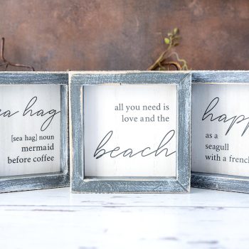 Sunsationsl Set Beach House Wood Sign Collection of (3) Beach House Wood Signs with Coastal and Beach vibe sayings on Rustic white wood top and background