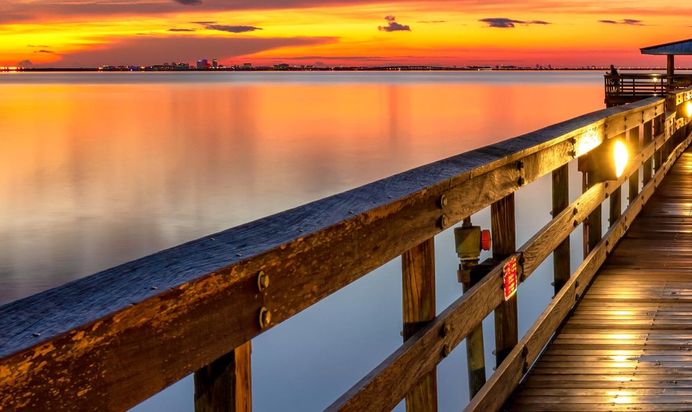 Right railing closeup of Welcome to Morning a Safety Harbor Pier sunrise photograph taken a few moments before sunrise with a colorful scene