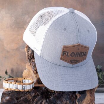 Coastal Shores Collection of the Nordic Wood Maple Wood Bracelet and the RANGE Leather Florida Established Hat in Heather White & Gray on Wood and Rustic Background