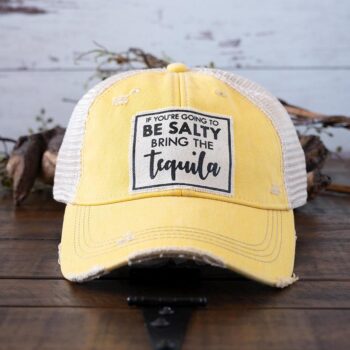 If You're Going to be Salty, Bring the Tequila distressed trucker cap perfect for the southern lifestyle against a rustic background