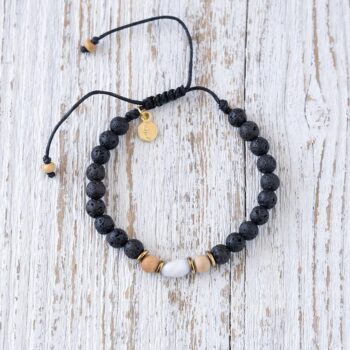 Top View of the Mystic Flame Santo Moonstone Bracelet on a rustic piece of wood
