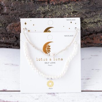 Southern Shores Pearl Necklace Stack against a textured piece of wood