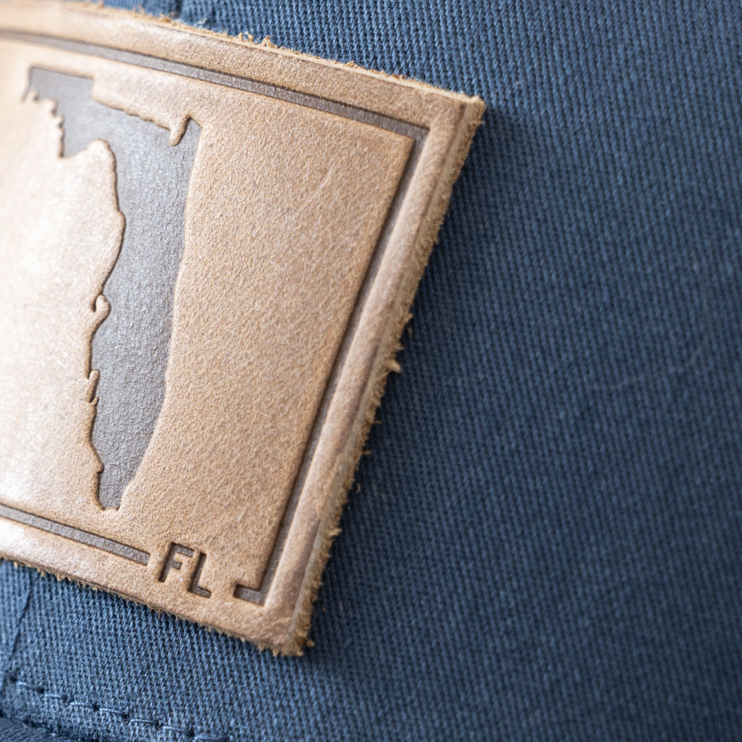 Closeup of the leather patch on the State of Florida leather patch hat in the color navy by RANGE Leather