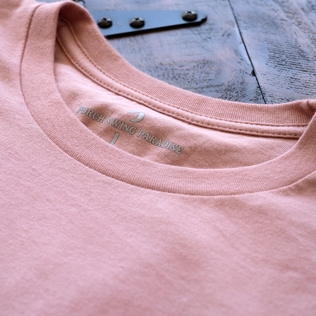 Closeup view of the collar and inside Porch Swing Paradise tagging on the Livin' Life on the Line tee in the color dessert pink by Porch Swing Paradise
